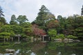 Peaceful Japanese zen garden and pond in Autumn Royalty Free Stock Photo