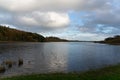 Peaceful lake Muckno in County Monaghan, Ireland with fluffy clouds in the background