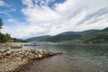 Peaceful Lakeside Rocky Beach with a Mountain