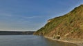 Peaceful landscape nature scenic view hill land lake reservoir coast line calming outdoor environment spring time day HDR