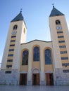 A peaceful landscape in the region of Medjugorje, Bosnia and Herzegovina, with the towers of the church of St. James in the Royalty Free Stock Photo