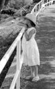 Peaceful little girl in a white dress