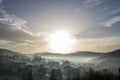 Peaceful misty landscape, rural autumn panorama under bright blu Royalty Free Stock Photo