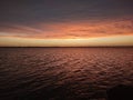 Peaceful moment on the lake absorbing the sunset Royalty Free Stock Photo