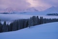 Peaceful morning sunrise purple clouds blue mountain winter