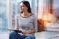 Peaceful morning of a woman sitting with a modern tablet