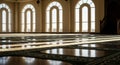 Peaceful Mosque Interior with Sunlight and Prayer Rugs Royalty Free Stock Photo