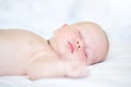 Peaceful newborn baby lying on a bed sleeping Royalty Free Stock Photo