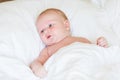 Peaceful newborn baby lying on a bed sleeping Royalty Free Stock Photo