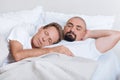 Peaceful non-traditional couple sleeping together Royalty Free Stock Photo