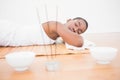 Peaceful pretty woman lying a bamboo mat Royalty Free Stock Photo