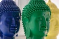 Peaceful profile of Buddha head closeup with copyspace. green, blue, yellow face of statue Buddha in yoga meditation Royalty Free Stock Photo