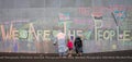 Peaceful Protestors decorate the wall of the Beehive