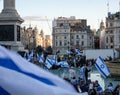 Crowds waving Israeli flags at pro-Israel solidarity rally at Trafalgar Square in London, UK