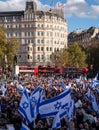 Crowds of people waving Israeli flags at pro-Israel solidarity rally at Trafalgar Square in London, UK