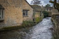 Peaceful river flows between two picturesque historic buildings