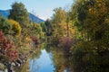 Peaceful river schlierach in vivid autumn colors