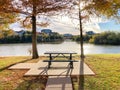 Peaceful riverside picnic table and corporate building offices along Trinity River near Dallas, Texas, America Royalty Free Stock Photo