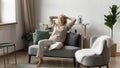 Peaceful satisfied mature woman relaxing on comfortable sofa at home Royalty Free Stock Photo