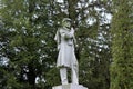 Peaceful scene of large trees surrounding old, weathered gravestone of soldier, Saratoga Monument and Victory Woods Cemetery, 2019