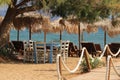 Typical greek scene at the kalives beach with wooden chairs and table