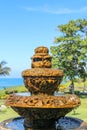 Peaceful scenery with fountain. Park near the Hindu Temple Tanah Lot, Bali, Indonesia. Small decorative fountain in tropical Royalty Free Stock Photo