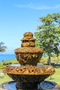 Peaceful scenery with fountain. Park near the Hindu Temple Tanah Lot, Bali, Indonesia. Small decorative fountain in tropical Royalty Free Stock Photo