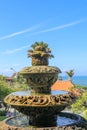 Peaceful scenery with fountain. Park near the Hindu Temple Tanah Lot, Bali, Indonesia. Small decorative fountain in tropical Royalty Free Stock Photo