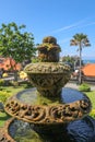 Peaceful scenery with fountain. Park near the Hindu Temple Tanah Lot, Bali, Indonesia. Small decorative fountain in tropical Royalty Free Stock Photo