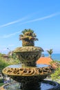 Peaceful scenery with fountain. Park near the Hindu Temple Tanah Lot, Bali, Indonesia. Small decorative fountain in tropical Royalty Free Stock Photo