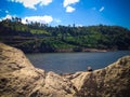 Peaceful Scenery Lake Water Dam And The Hills From Rock Excavation On A Sunny Day Royalty Free Stock Photo