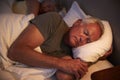 Peaceful Senior Man Asleep In Bed At Night Royalty Free Stock Photo