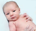 Peaceful serene blue eyed newborn baby