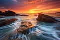 Peaceful and serene moments of sunrise on a rocky sea shore.