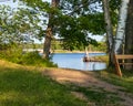 Peaceful setting of bench in park alongside Chippewa Flowage shoreline