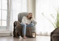 Peaceful sleepy pretty young woman resting in comfortable armchair