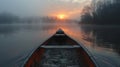 The peaceful solitude of a canoe on a misty lake at dawn Royalty Free Stock Photo