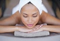 In a peaceful state of mind. a young woman lying on a massage table. Royalty Free Stock Photo