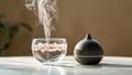Aromatherapy diffuser with steaming glass cup Royalty Free Stock Photo