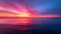 A peaceful stillness envelopes the ocean as the horizon is transformed into a canvas of vivid hues. The sky seems to be