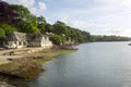 A peaceful summer morning on the Helford Estuary at old fashioned Port Navas, Cornwall, UK Royalty Free Stock Photo