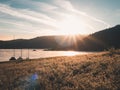 Peaceful sunrise at the lake: Sailing boats moored, quiet mood Royalty Free Stock Photo