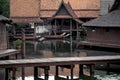 Peaceful thai floating architecture with traditional wooden house and bridge in Ancient City