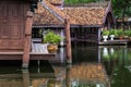 Peaceful thai floating architecture with traditional wooden house and bridge in Ancient City