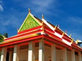 Peaceful Thai temple soaring into blue sky
