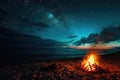 A peaceful and tranquil evening scene with a campfire crackling on a sandy beach, illuminated by the starry night sky, A chilled Royalty Free Stock Photo