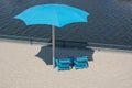 Blue Beach Cahirs annd Umbrella Royalty Free Stock Photo