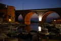 Peaceful view of the arched bridge over the marina of the Vallon des Auffes with sea, at sunset, Parc National des Calanques, Mars Royalty Free Stock Photo