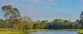 Peaceful view of the lake, green grass and trees of this Golf Course in Georgia Royalty Free Stock Photo