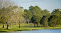 Peaceful view of the lake, green grass and trees of this Golf Course in Georgia Royalty Free Stock Photo